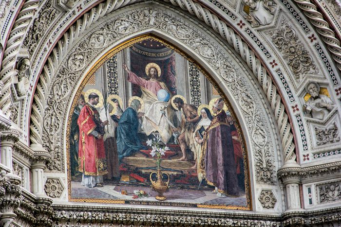 The Central Mosaic Of Christ, The Virgin Mary And Saint John The Baptist On The Exterior Facade Of The Cattedrale di Santa Maria del Fiore In Florence Italy