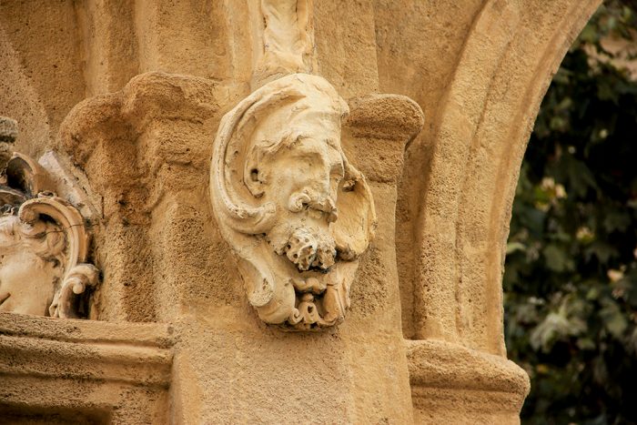 A Male Figure On The Wall Entrance Of The Hotel de Caumont In Aix-en-Provence