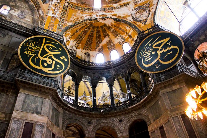 Light Shining Through The Windows Of The Interior South Wall Of Hagia Sophia In Istanbul Turkey Displaying Corinthian Style Columns And The Calligraphic Roundels
