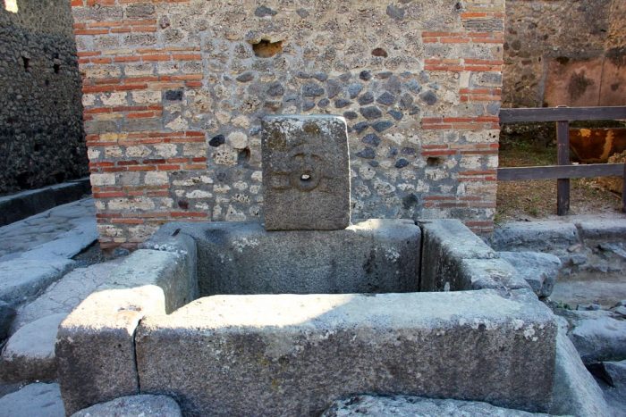 A Water Fountain On The Streets Of The Ancient City Of Pompeii