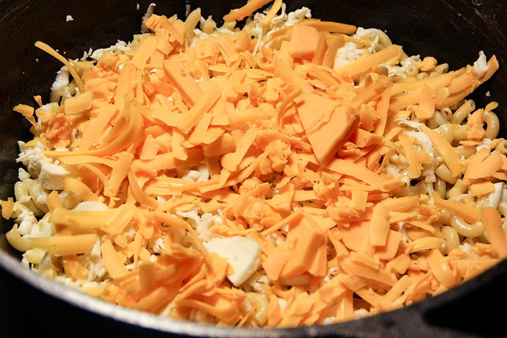 Adding Layer of Sharp Cheddar Cheese