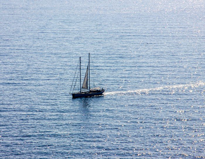 A Boat Off The Coast Of The Island Of Capri In Italy