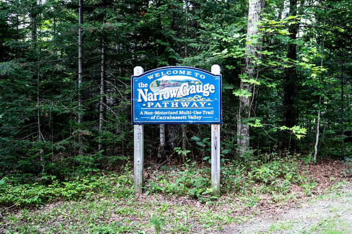 The Narrow Gauge Pathway Entrance Sign Near Sugarloaf In Maine