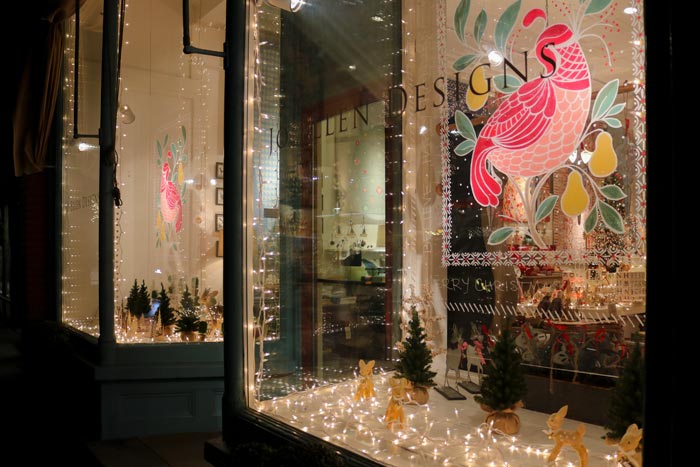 The Window Of The Jo Ellen Designs Store Decorated For The Holidays