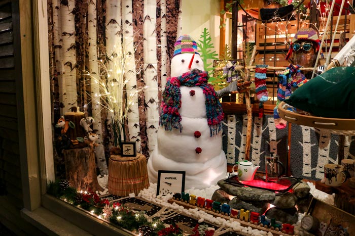 A Snowman Window Display In The Once A Tree Store