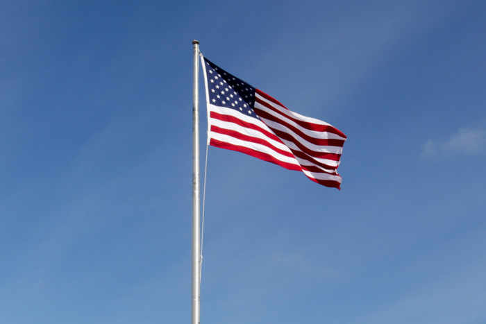 American Flag Against A Blue Sky