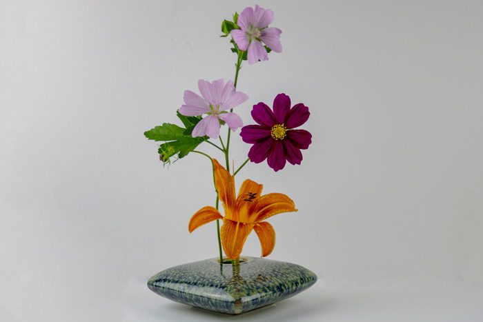 Ikebana Flowers Against A White Background