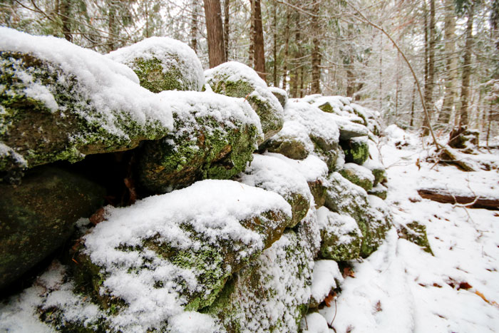 Rock Wall Covered In Snow
