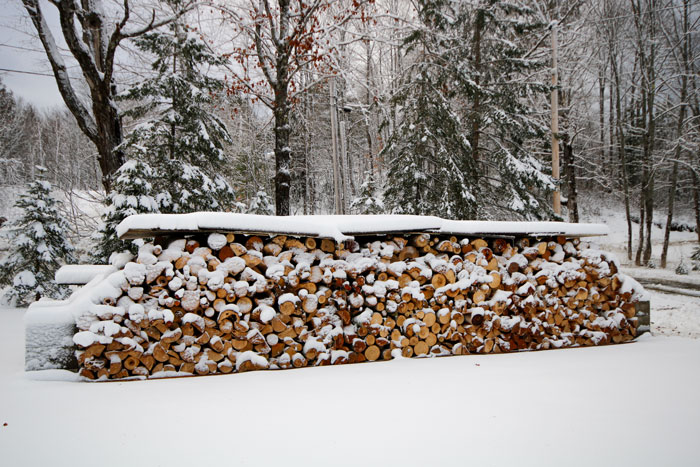 Wood Pile Covered With Snow