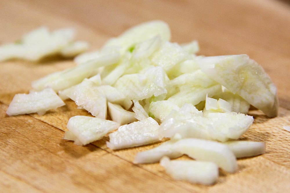 Chopped Garlic on Wooden Cutting Board