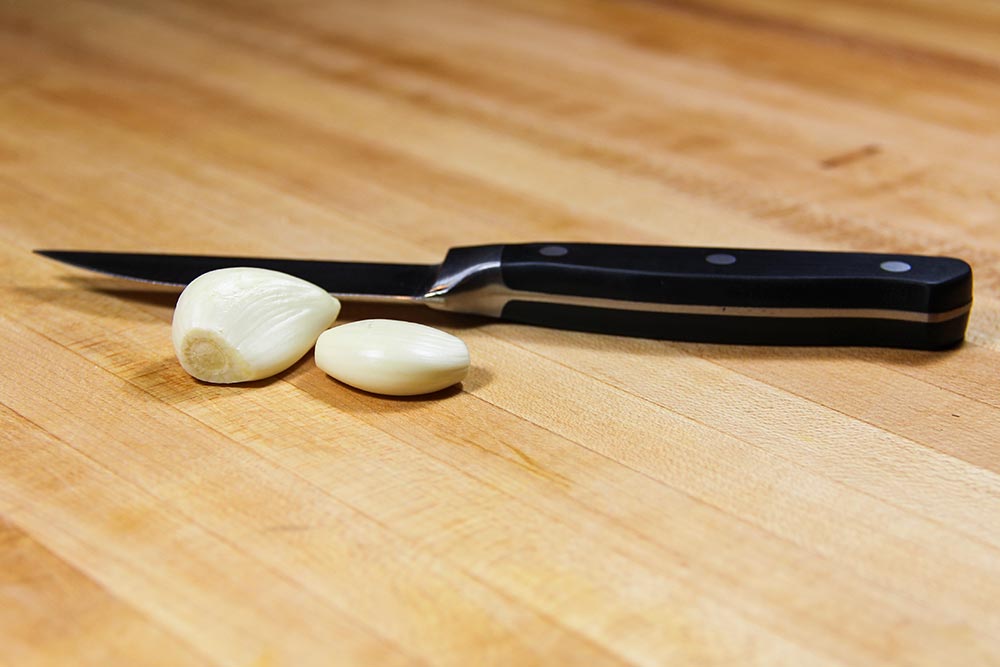 Peeled Garlic Cloves With Paring Knife