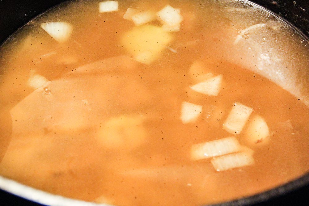Adding Vegetable Broth to a Soup