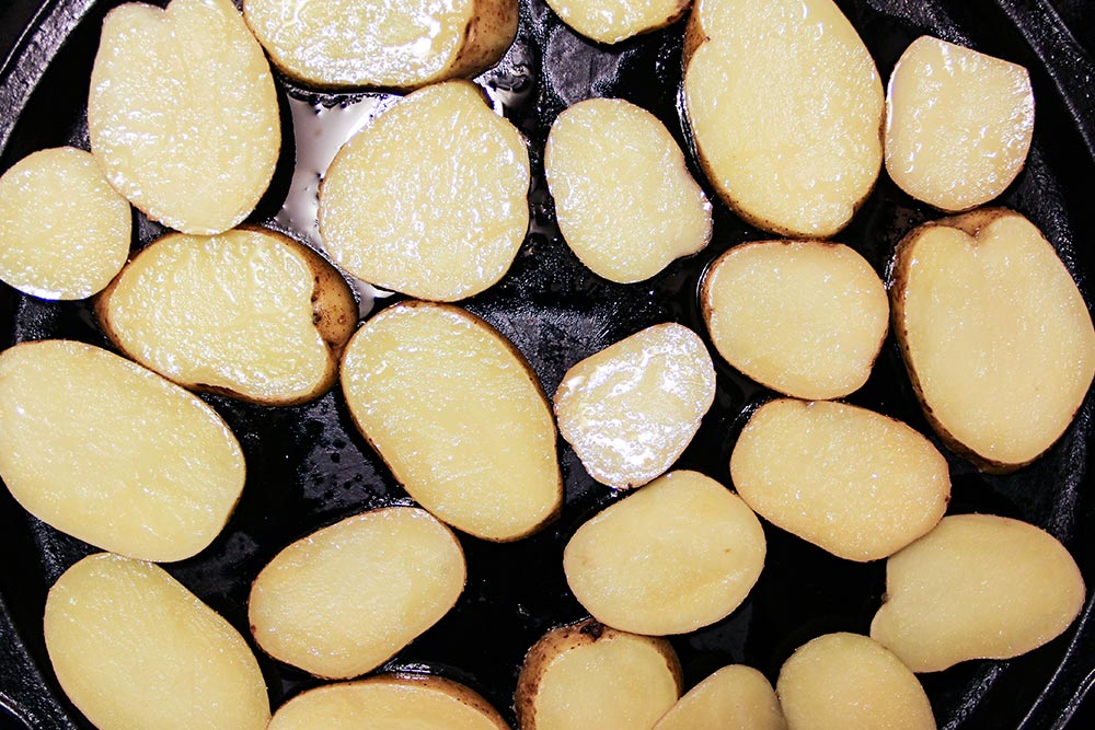 Olive Oil Coated Potatoes on Baking Sheet